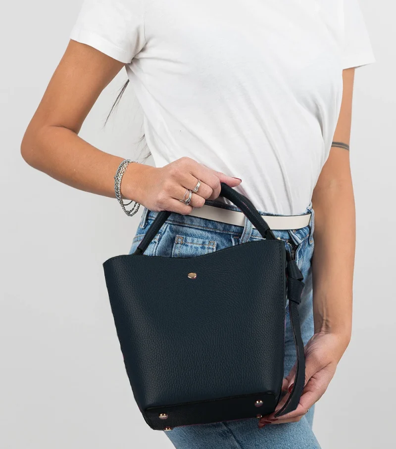 Star black leather bag on model Star black leather bag on model