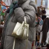 Star gold leather bag on model