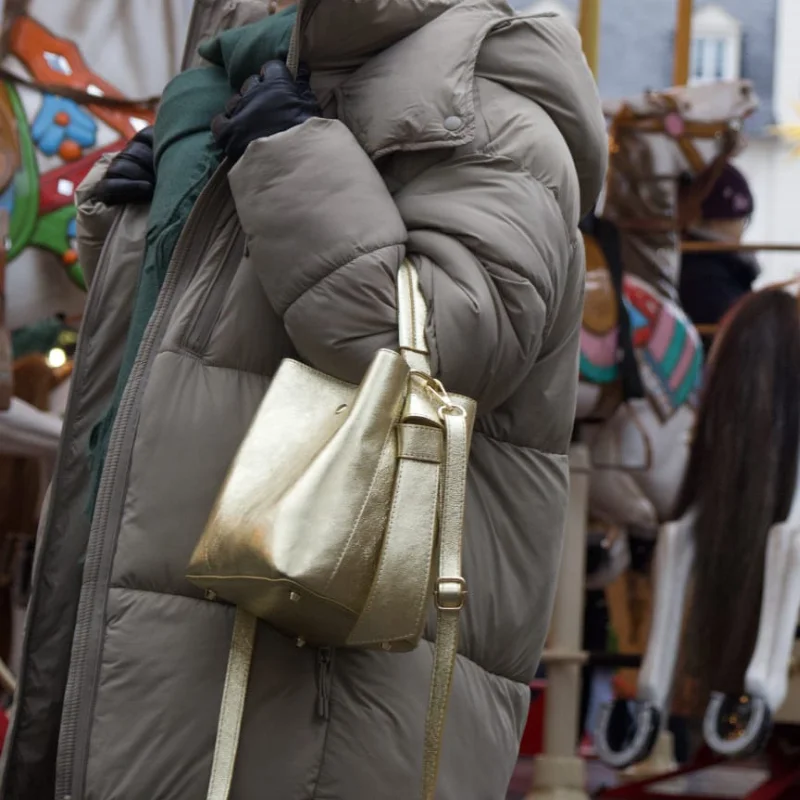 Star gold leather bag on model