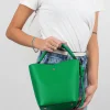 Star green leather bag on model