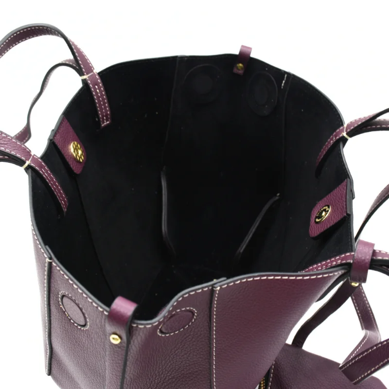 mag burgundy leather woman interior