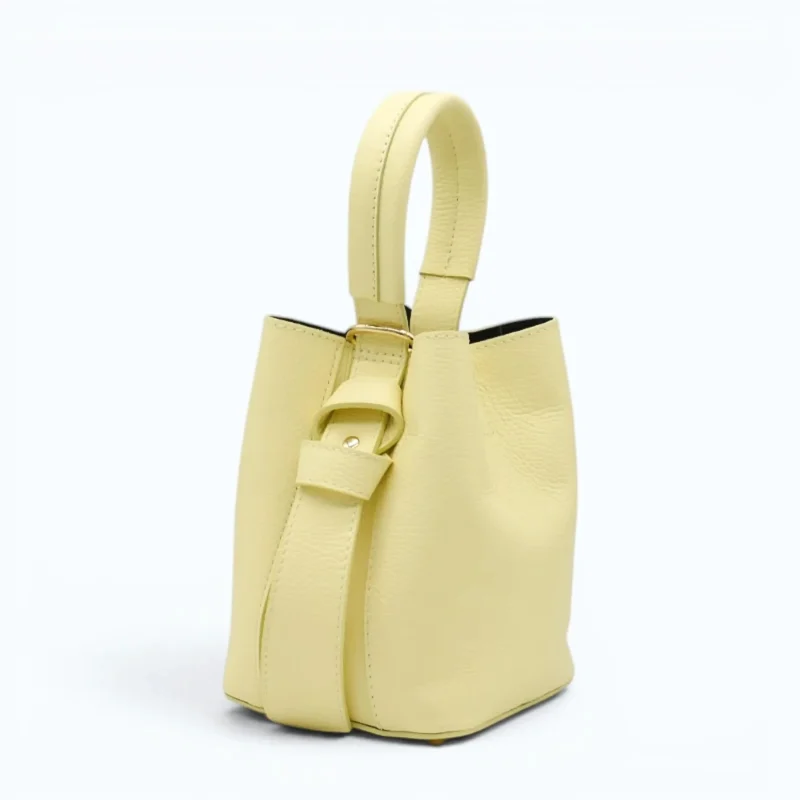 Flow butter yellow leather handbag  closed side