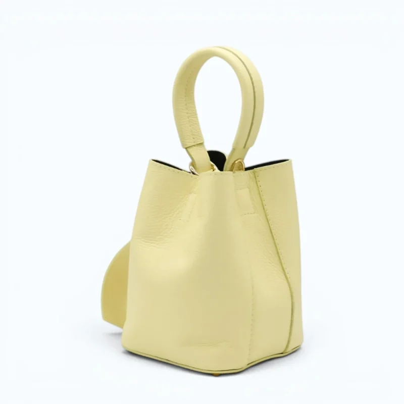 Flow butter yellow leather handbag  closed side 2