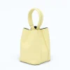 Flow butter yellow leather handbag  closed side 2