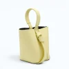 Flow butter yellow leather handbag  sides
