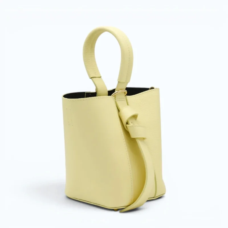 Flow butter yellow leather handbag  sides