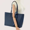 blue tote leather bag on model blue tote leather bag on model