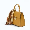 diva yellow leather handbag side