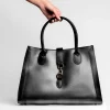 grace black leather handbag on model