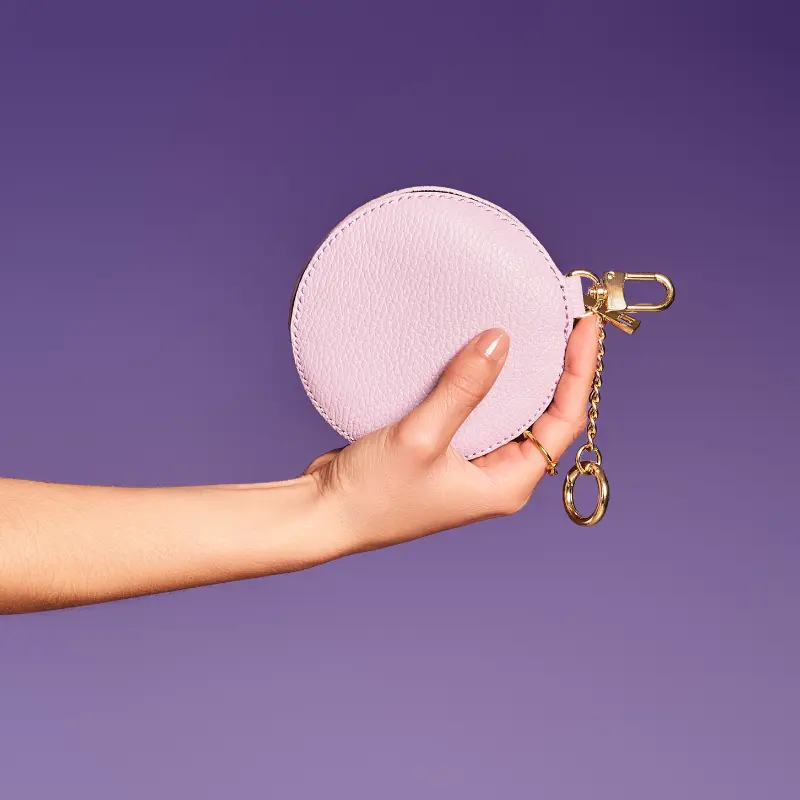 circle lilac coin purse on hand