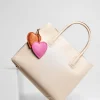 red pink heart key holder on bag