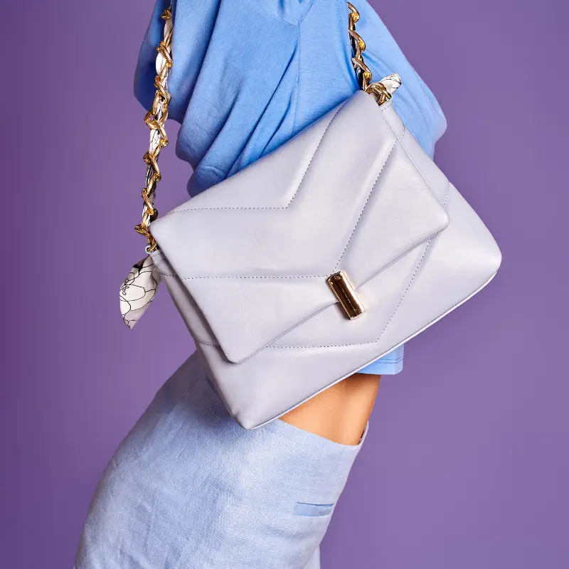 serena blue leather shoulder bag on model