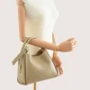 bruna taupe leather handbag on hand