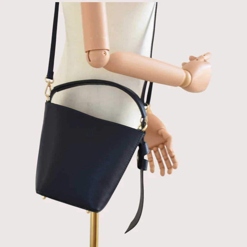 Flow Navy Blue Leather Handbag crossbody hands