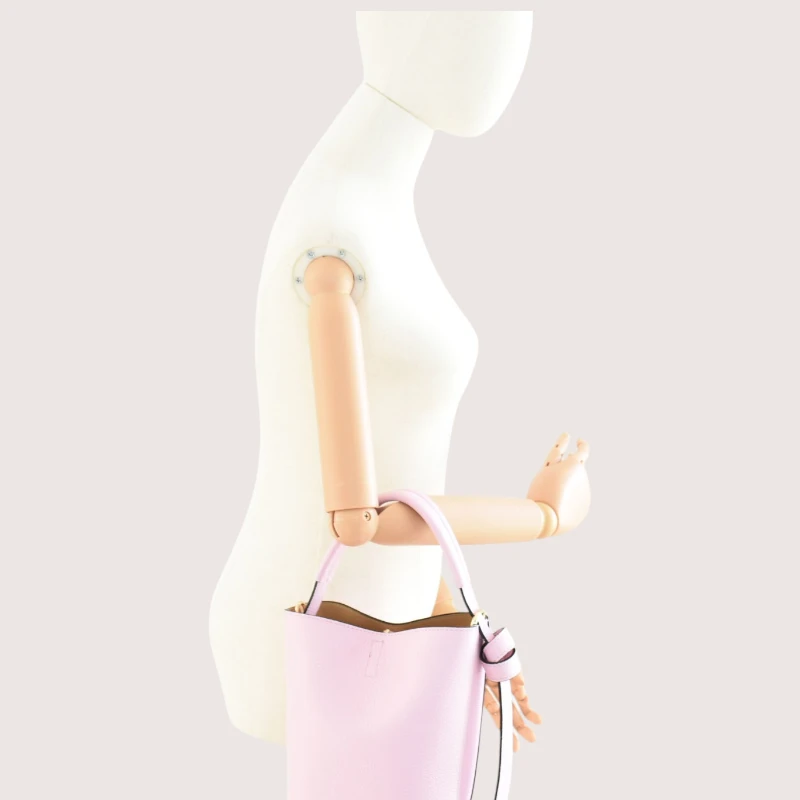 Flow pink leather handbag interior on hand