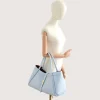 Marge Baby Blue Leather Handbag hand model