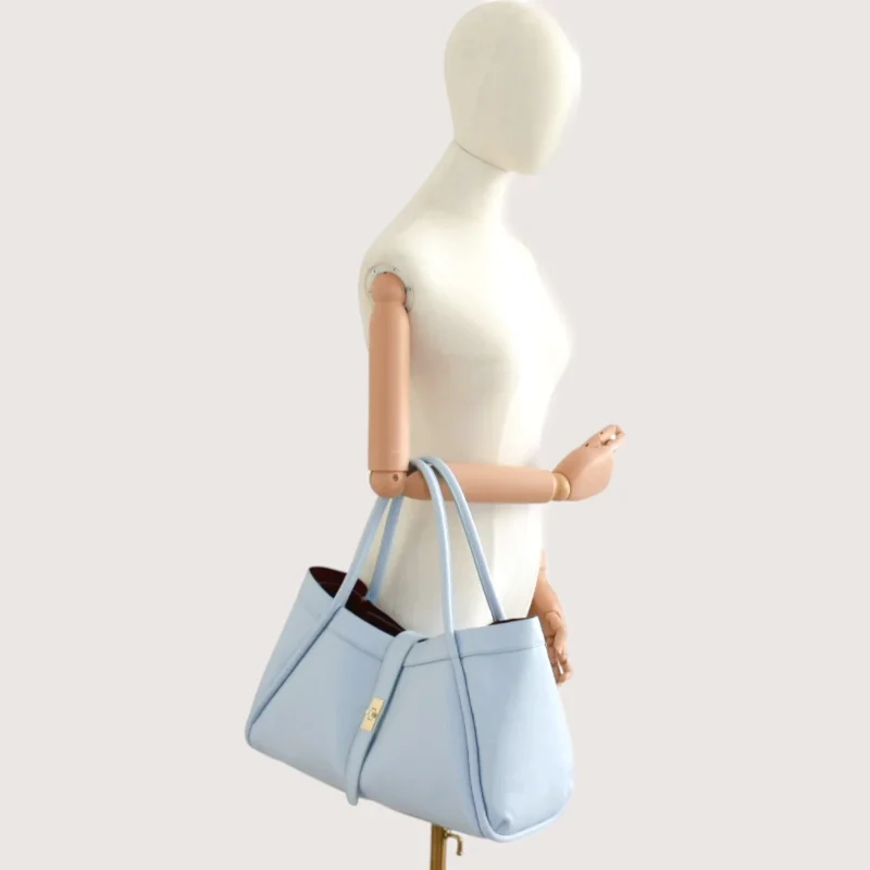 Marge Baby Blue Leather Handbag hand model