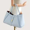 Marge Baby Blue Leather Handbag on hand