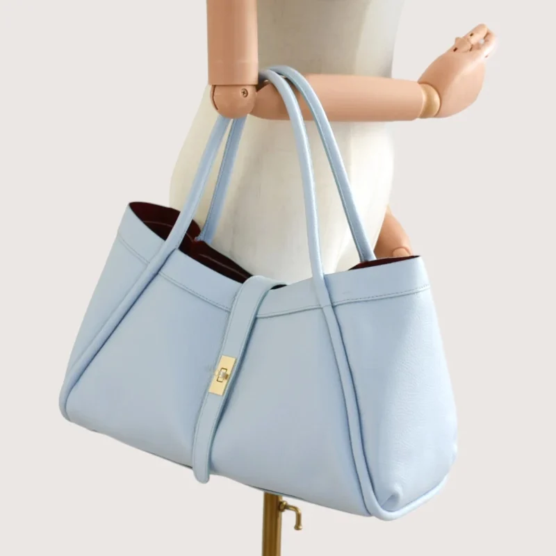 Marge Baby Blue Leather Handbag on hand