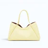 Marge butter yellow Leather handbag back