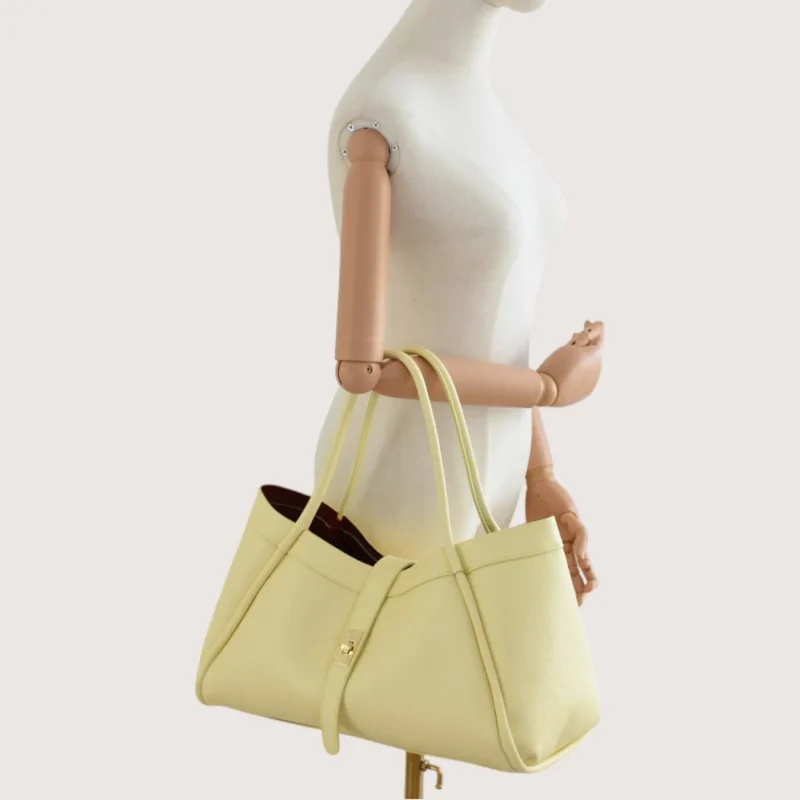 Marge butter yellow Leather handbag on hand