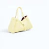 Marge butter yellow Leather handbag side