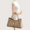 Marge Taupe Leather Handbag hand on model