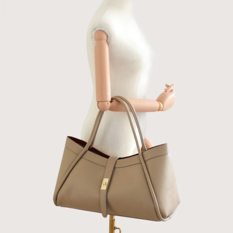 Marge Taupe Leather Handbag hand on model