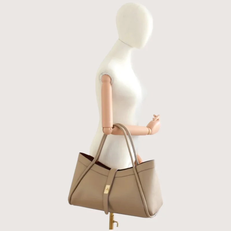 Marge Taupe Leather Handbag on hand