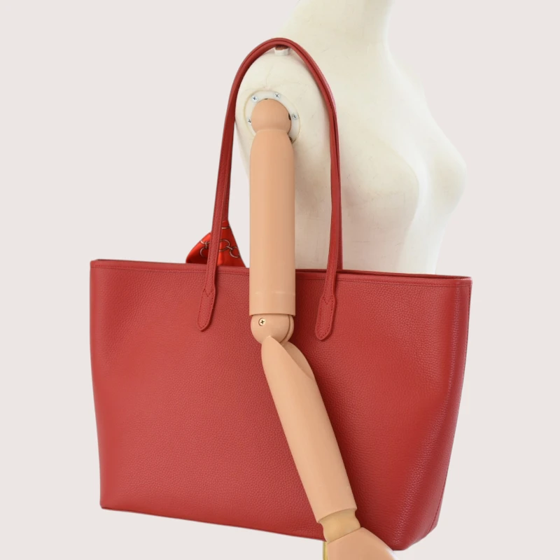 red leather tote bag on model