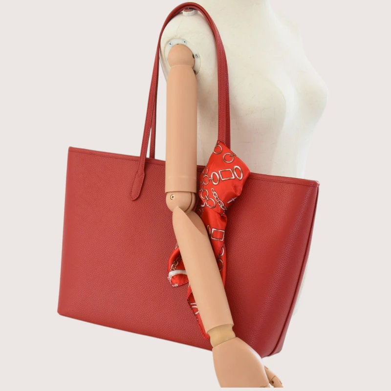 red leather tote bag on model